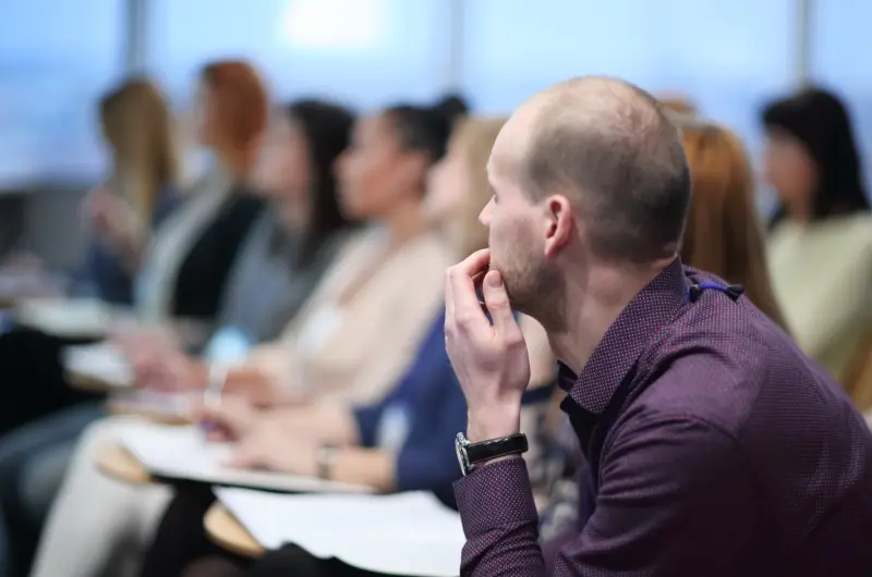 serious businessman on blurred background of the conference hall